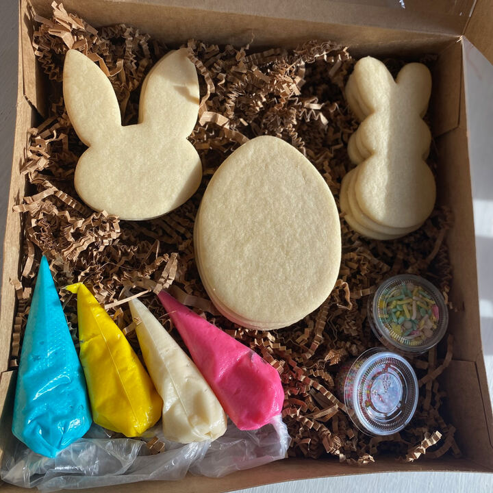Easter cookie kit with undecorated bunny and egg cookies, frosting bags and sprinkles